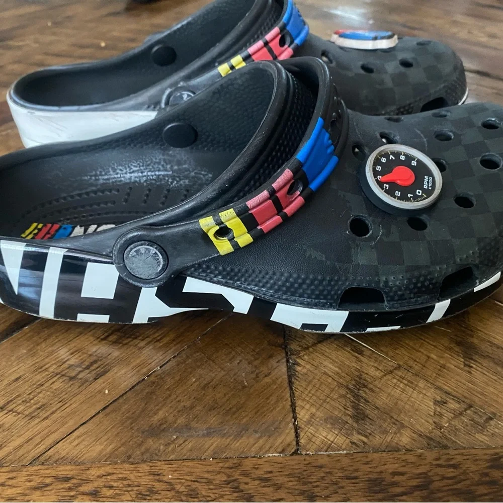 CROCS Kids Black Clogs with Blue and Red Accents